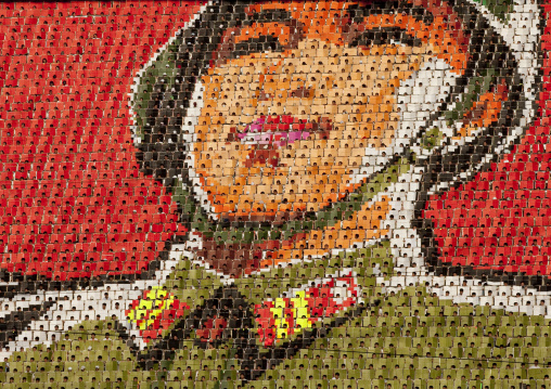 North Korean soldier made by children pixels holding up colored boards during Arirang mass games in may day stadium, Pyongan Province, Pyongyang, North Korea