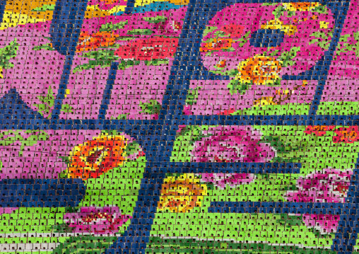 Korean letters made by children pixels holding up colored boards during Arirang mass games in may day stadium, Pyongan Province, Pyongyang, North Korea