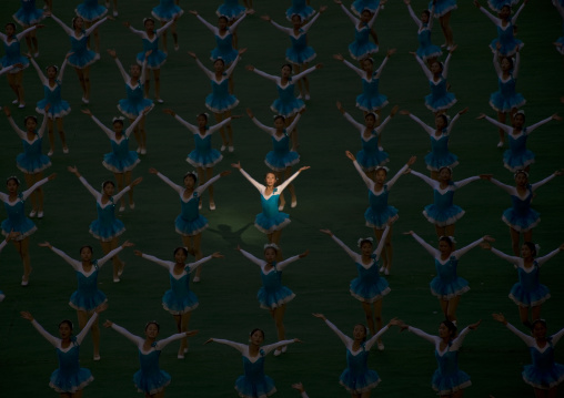 North Korean gymnast in a ray of sun during Arirang mass games in may day stadium, Pyongan Province, Pyongyang, North Korea