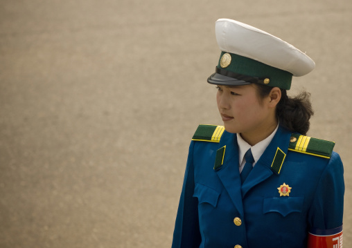 North Korean traffic security officer in blue uniform in the street, Pyongan Province, Pyongyang, North Korea