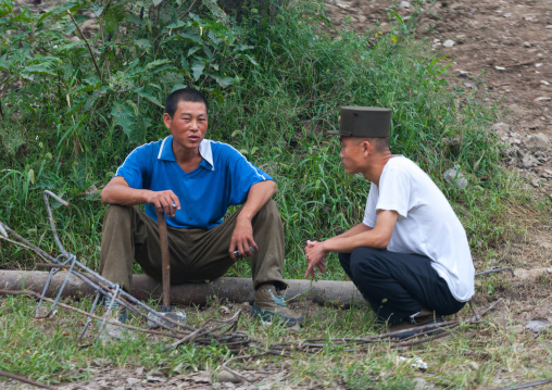 North Korean soldiers half dressed in military uniforms taking a rest, Pyongan Province, Pyongyang, North Korea