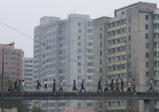 North Korean people crossing a bridge in the city center, Pyongan Province, Pyongyang, North Korea