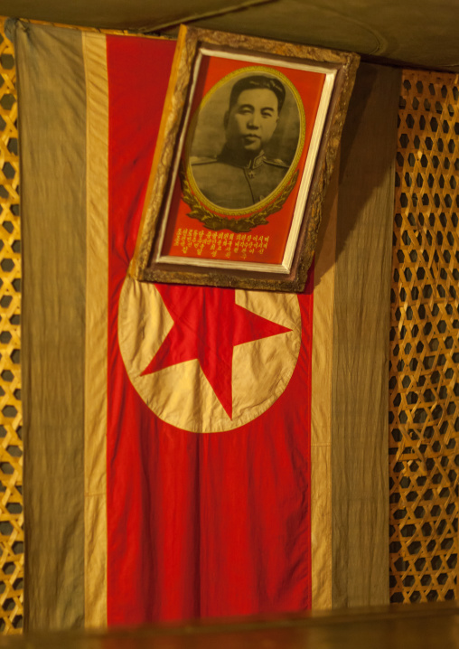 Kim Il-sung portrait and North Korean flag in the victorious fatherland liberation war museum, Pyongan Province, Pyongyang, North Korea