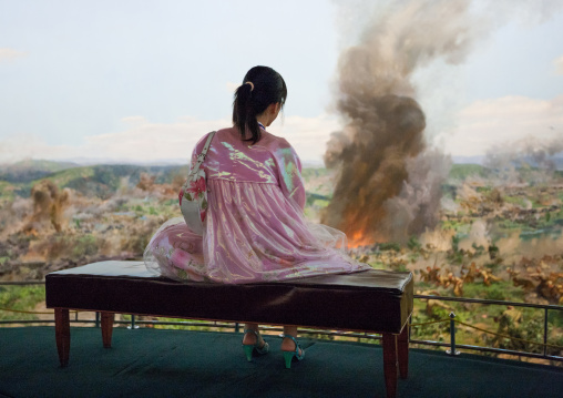 North Korean visitor lookingthe battle of taejon diorama in the victorious fatherland liberation war museum, Pyongan Province, Pyongyang, North Korea