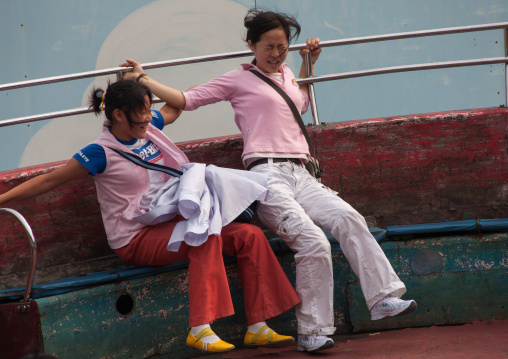 North Korean people enjoying an attraction in Taesongsan funfair, Pyongan Province, Pyongyang, North Korea