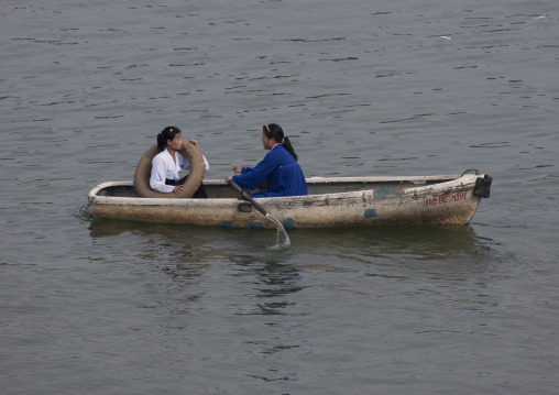 North Korean people in rowing boats on Taedong river, Pyongan Province, Pyongyang, North Korea
