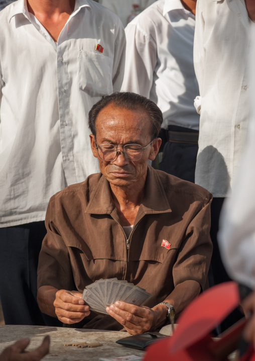 Portrait of a North Korean man playing cards, Pyongan Province, Pyongyang, North Korea