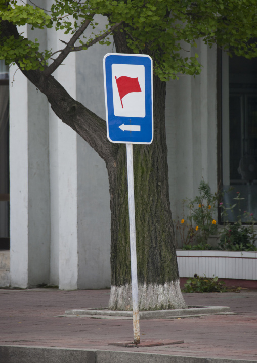 Red flag street sign for a revolutionary site, Kangwon Province, Wonsan, North Korea
