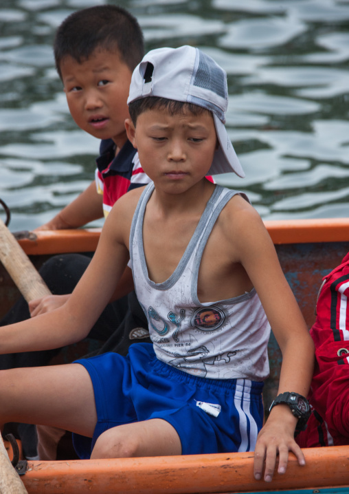 North Korean pioneers boys in boats in Songdowon international children's camp, Kangwon Province, Wonsan, North Korea