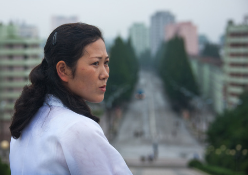 Portrait of a North Korean woman overlooking the city, South Hamgyong Province, Hamhung, North Korea