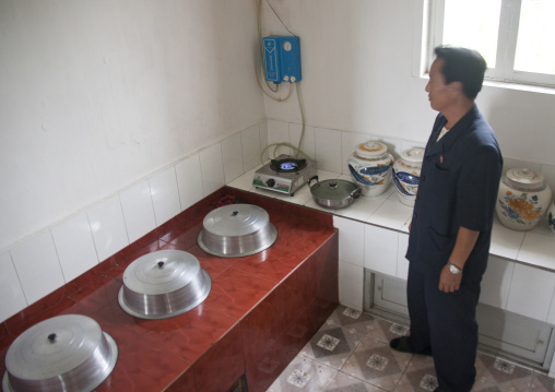 North Korean man using methane gas in his kitchen, South Hamgyong Province, Hamhung, North Korea