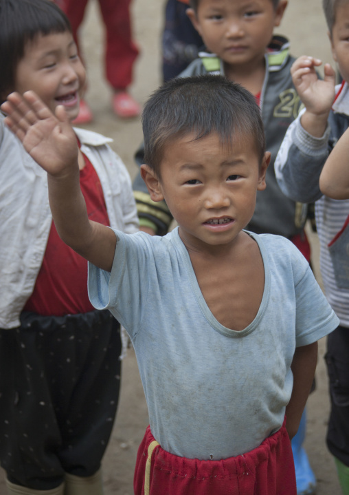 North Korean skinny boy raising hand in a school, South Hamgyong Province, Hamhung, North Korea