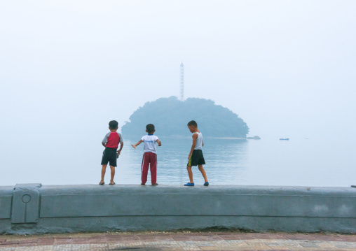 North Korean children in front of a little island, South Hamgyong Province, Hamhung, North Korea