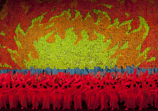 North Korean dancers in front of a sky of fire made by children pixels holding up colored boards during Arirang mass games in may day stadium, Pyongan Province, Pyongyang, North Korea