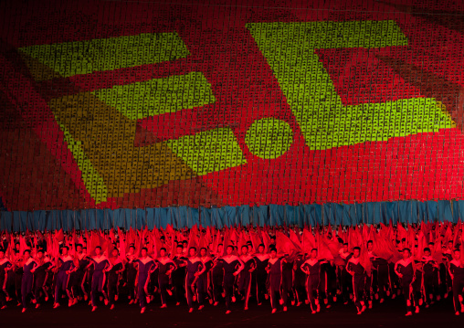 Anti capitalism human fresco made by children pixels holding up colored boards during Arirang mass games in may day stadium, Pyongan Province, Pyongyang, North Korea