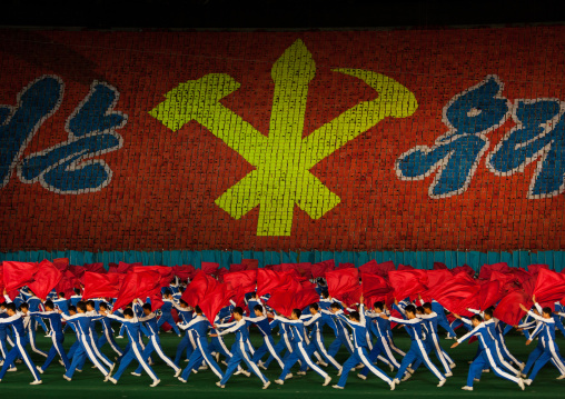 Workers' Party logo made by children pixels holding up colored boards during Arirang mass games in may day stadium, Pyongan Province, Pyongyang, North Korea