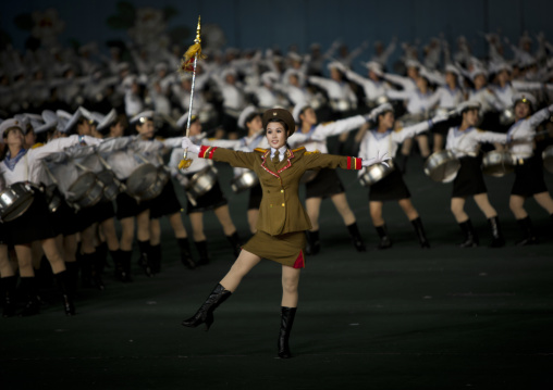 Sexy North Korean women dressed as soldiers dancing with swords during the Arirang mass games in may day stadium, Pyongan Province, Pyongyang, North Korea