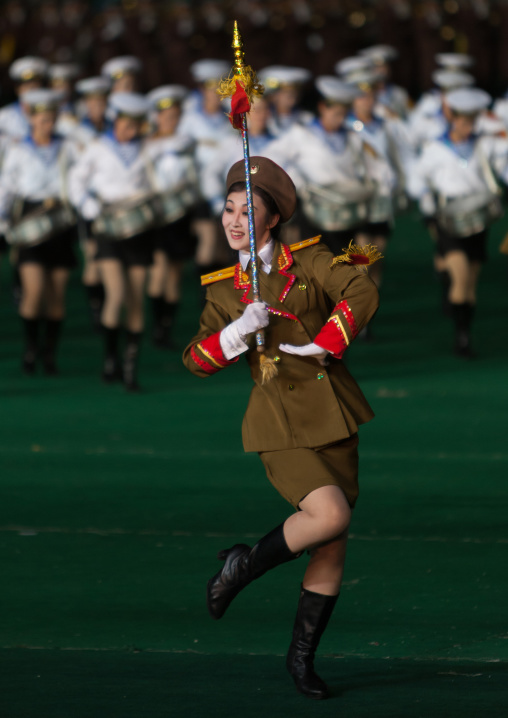 Sexy North Korean women dressed as soldiers dancing with swords during the Arirang mass games in may day stadium, Pyongan Province, Pyongyang, North Korea