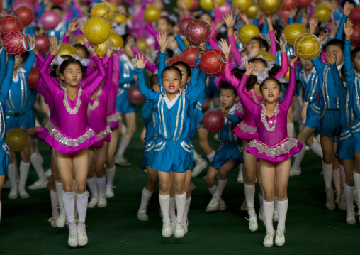 North Korean children performing with balloons during the Arirang mass games in may day stadium, Pyongan Province, Pyongyang, North Korea