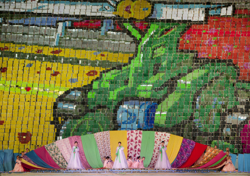 North Korean singers in choson-ot in front of human fresco at Arirang mass games in may day stadium, Pyongan Province, Pyongyang, North Korea