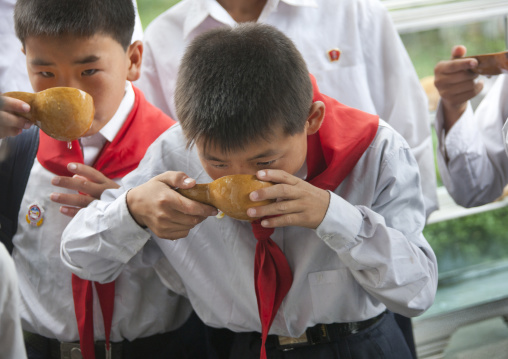 Children drinking from a well at Kim il Sung Mangyongdae native house, Pyongan Province, Pyongyang, North Korea