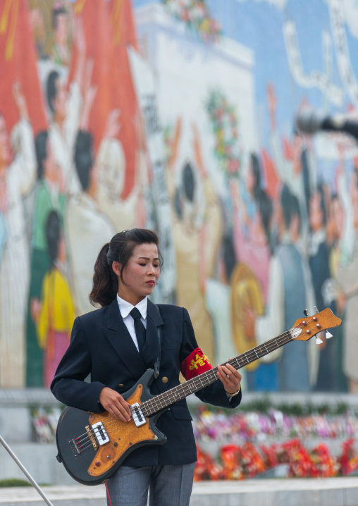 North Korean state artist playing bass on national day, Pyongan Province, Pyongyang, North Korea