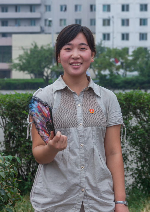 Portrait of a smiling North Korean young woman in the street, Pyongan Province, Pyongyang, North Korea