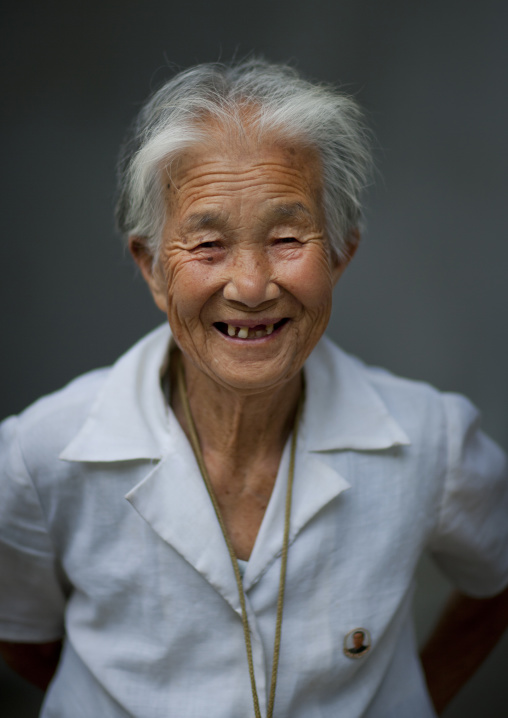 North Korean elderly woman smiling with toothless grin, Pyongan Province, Pyongyang, North Korea