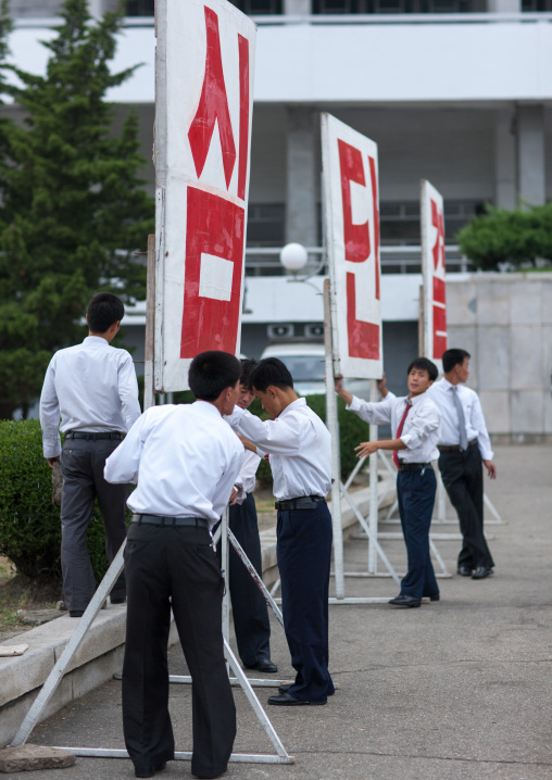 Propaganda billboards during a mass dance performance on september 9 day of the foundation of the republic, Pyongan Province, Pyongyang, North Korea