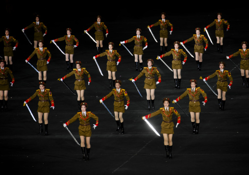 Sexy North Korean women dressed as soldiers dancing with swords during the Arirang mass games in may day stadium, Pyongan Province, Pyongyang, North Korea