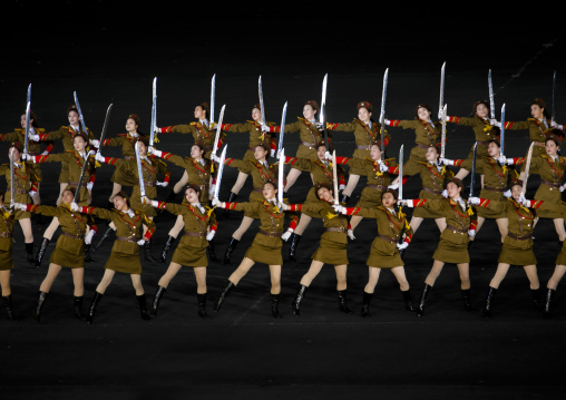 Sexy North Korean women dressed as soldiers dancing with swords during the Arirang mass games in may day stadium, Pyongan Province, Pyongyang, North Korea