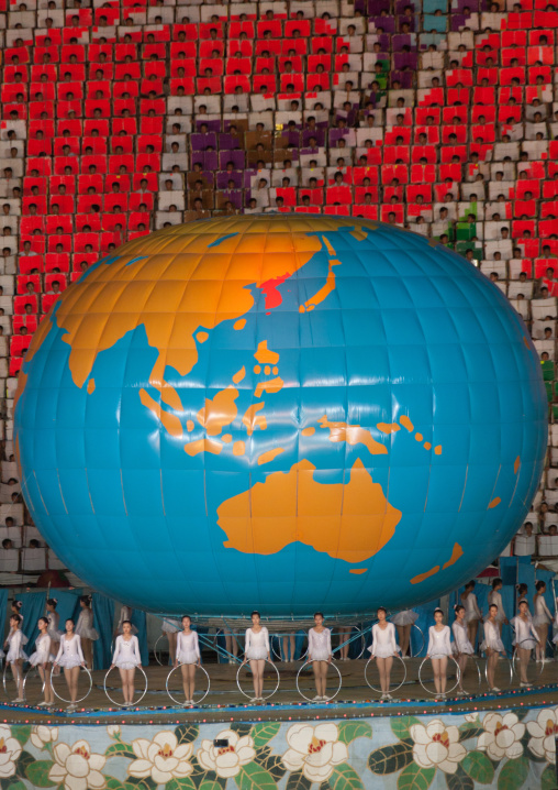 North Korean dancers in front of a world globe during the Arirang mass games in may day stadium, Pyongan Province, Pyongyang, North Korea