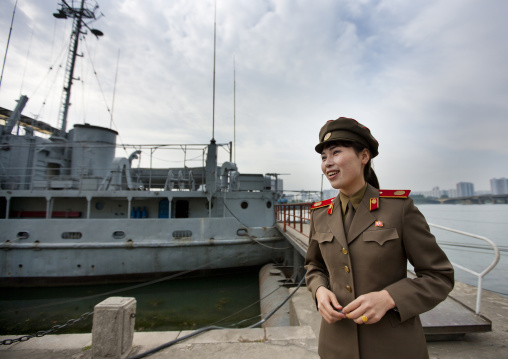 North Korean guide in front of Uss Pueblo american spy ship, Pyongan Province, Pyongyang, North Korea