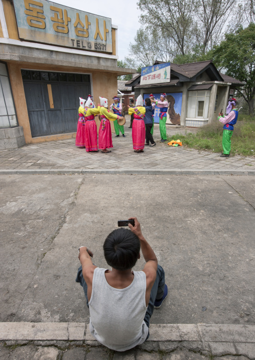 North Korean man sitting down on film set at Pyongyang film studio, Pyongan Province, Pyongyang, North Korea