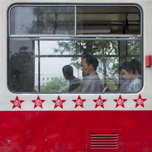 Public bus decorated with red stars one star represents 50000 km of safe driving, Pyongan Province, Pyongyang, North Korea