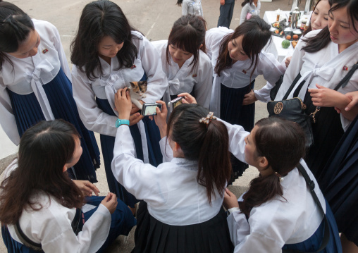 Japanese tourists women originated from North Korea during a touristic visit taking pictures of a cc, Pyongan Province, Pyongyang, North Korea