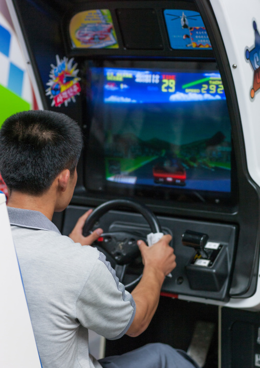 North Korean child on a car simulator in Kaeson youth park, Pyongan Province, Pyongyang, North Korea
