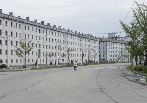 North Korean male traffic security officer in white uniform in the street, Kangwon Province, Wonsan, North Korea