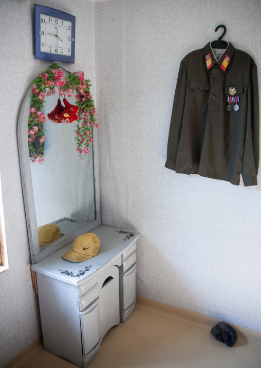 Military jacket hung in a North Korean house, Kangwon Province, Chonsam, North Korea