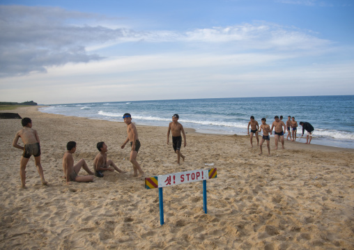 Group of North Korean boys playing at the beach, North Hamgyong Province, Chilbo Sea, North Korea