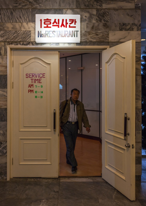 North Korean man coming out of the number one restaurant in yangakkdo hotel, Pyongan Province, Pyongyang, North Korea