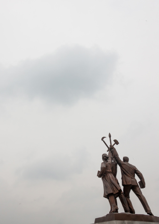 Statues at the bottom of the Juche tower built to commemorate Kim il-sung's 70th birthday, Pyongan Province, Pyongyang, North Korea