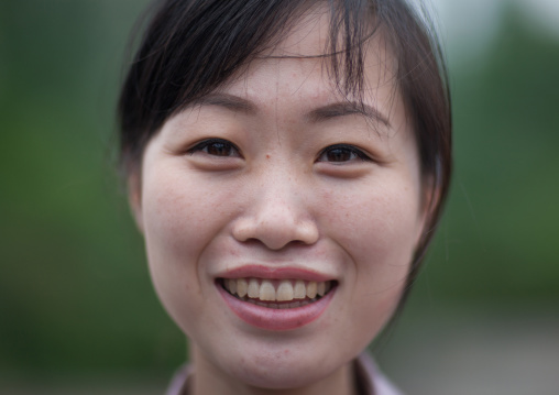 Portrait of a smiling North Korean woman, Pyongan Province, Pyongyang, North Korea