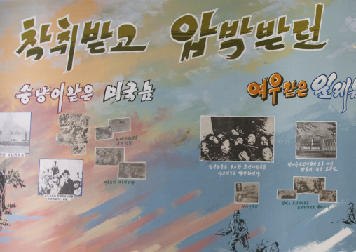 North Korean propaganda poster in a primary school depicting the japanese killings during the war, South Pyongan Province, Chongsan-ri Cooperative Farm, North Korea
