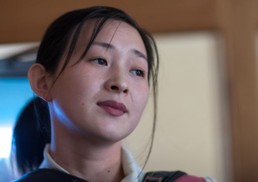 North Korean waitress in a restaurant, Pyongan Province, Pyongyang, North Korea