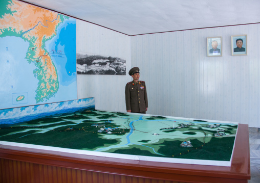 North Korean soldier in the joint security area in front of the map of Korea, North Hwanghae Province, Panmunjom, North Korea