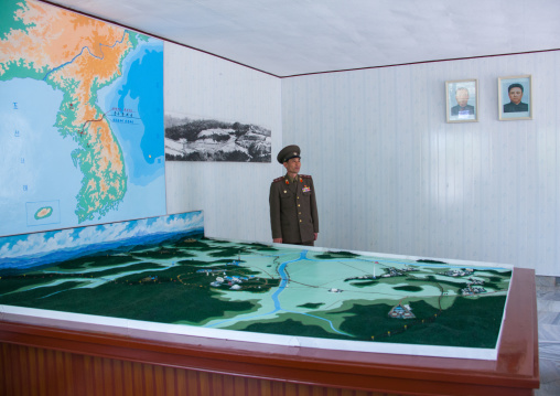 North Korean soldier in the joint security area in front of the map of Korea, North Hwanghae Province, Panmunjom, North Korea