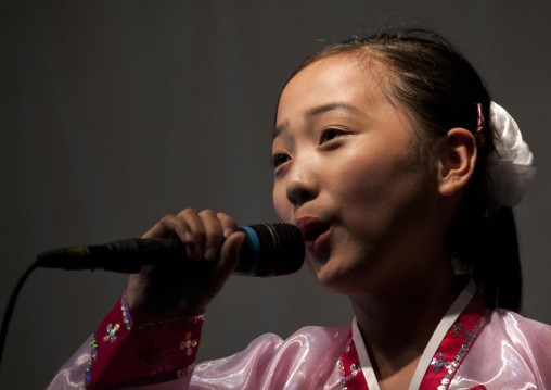 North Korean girl singing during a show for toursist in a school, Pyongan Province, Pyongyang, North Korea