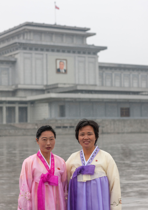 North Korean women under the rain in Kumsusan memorial palace, Pyongan Province, Pyongyang, North Korea
