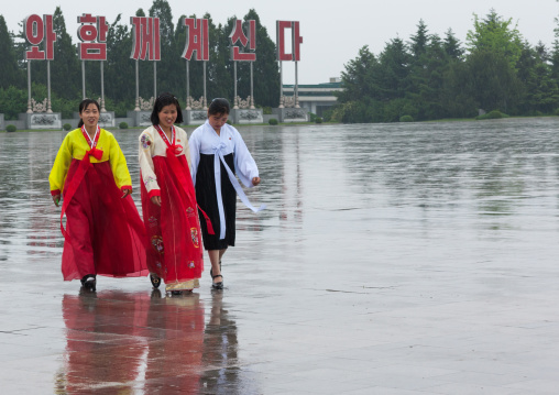North Korean women under the rain in Kumsusan memorial palace, Pyongan Province, Pyongyang, North Korea